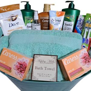 The Automotive Basket is a thoughtfully curated gift, perfect for anyone needing a bit of pampering. It includes Dove lotion, Suave shampoo, Caress soap bars, St. Ives acne control, a teal towel by Ashley Mills, toothbrushes, and toothpaste.