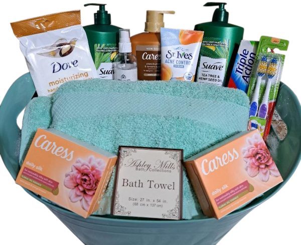 The Automotive Basket is a thoughtfully curated gift, perfect for anyone needing a bit of pampering. It includes Dove lotion, Suave shampoo, Caress soap bars, St. Ives acne control, a teal towel by Ashley Mills, toothbrushes, and toothpaste.