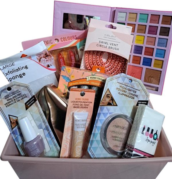 The Automotive Basket, a pink basket brimming with an assortment of beauty products like nail polish, exfoliating sponges, makeup brushes, liquid foundation, a large eyeshadow palette, lip glosses, and a contour and blush kit. All the items are vibrantly packaged as if they deserve a spotlight in an automotive showroom for beauty enthusiasts.