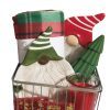 A festive gift basket featuring the Automotive Basket, which includes a red and green Christmas blanket, ceramic gnome figures in red and green hats, a green tree-shaped ornament, a red and white candle in a glass holder, and a red gift box with gold decorations—all perfectly organized in an automotive-themed metal wire basket.