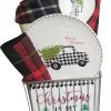 The Automotive Basket is a festive gift set that includes a white plate and bowl featuring a black-and-white plaid truck with a Christmas tree, complemented by a matching plaid napkin and hot pad. Additionally, it features a sign proclaiming "Christmas is my favorite" with tree illustrations, making it the perfect automotive-themed holiday treat.