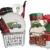 The "Automotive Basket" features two wire baskets filled with festive Christmas-themed items. The left basket contains plaid textiles, a "Merry Christmas" plate adorned with an automotive truck carrying a tree, and a dish. The right basket includes gnome figurines, a Christmas tree ornament, and holiday linens.