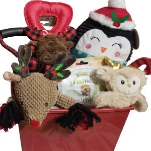 The Automotive Basket filled with holiday-themed dog toys and treats makes the perfect gift for your furry friend. It includes a plush penguin with a Santa hat, a plaid reindeer chew toy, a brown plush toy, a cream-colored owl, and a packet of dog treats. Ideal for festive fun after an automotive adventure!