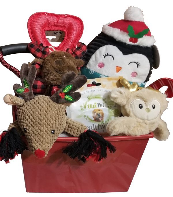 The Automotive Basket filled with holiday-themed dog toys and treats makes the perfect gift for your furry friend. It includes a plush penguin with a Santa hat, a plaid reindeer chew toy, a brown plush toy, a cream-colored owl, and a packet of dog treats. Ideal for festive fun after an automotive adventure!