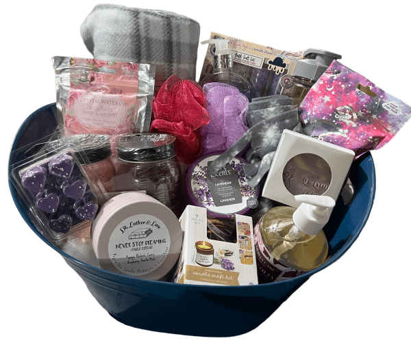 Introducing the Epic Women's Spa Basket—a luxurious blue gift basket brimming with self-care essentials. Inside, you'll find scented candles, a plaid blanket, bath bombs, a pink bath sponge, a sleep mask, a candle care kit, lavender wax melts, hand soap, and other relaxation products that make it the ultimate women's spa experience.