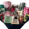 The Epic Women's Spa Basket is the perfect gift, featuring an assortment of self-care items such as bath salts, body lotion, candles, a water bottle, a hairbrush, a towel, plush socks, and skincare products. The spa-themed collection is elegantly arranged in a blue bucket with clear wrapping.