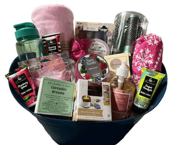 The Epic Women's Spa Basket is the perfect gift, featuring an assortment of self-care items such as bath salts, body lotion, candles, a water bottle, a hairbrush, a towel, plush socks, and skincare products. The spa-themed collection is elegantly arranged in a blue bucket with clear wrapping.