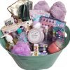 Introducing the Automotive Basket, a vibrant green gift basket brimming with an assortment of self-care items perfect for relaxation and indulgence. This thoughtfully curated set includes soap, candles, fleece socks, bath bombs, a bath sponge, a mug, and a range of skincare products—many of which are elegantly packaged in pastel pink and purple hues. Designed to offer the ultimate at-home spa experience, this basket is all about relaxation and pampering.