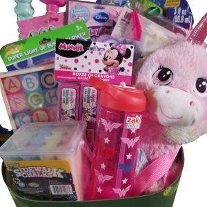 An Automotive Basket filled with various colorful toys and items, including a plush unicorn, alphabet blocks, a Minnie Mouse box of crayons, a Wonder Woman water bottle, sidewalk chalk, bubble sticks, a bubble pinwheel, and flamingo-shaped items is perfect for any child's delight.