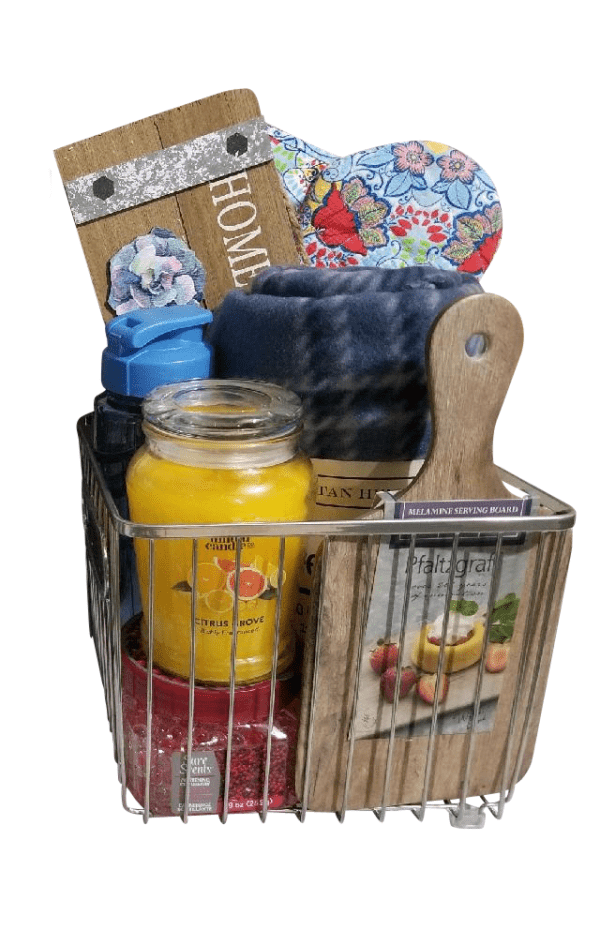 The Automotive Basket, filled with a yellow citrus candle, wooden cutting board, black water bottle, blue fleece blanket, wooden "HOME" sign with floral decor, and a heart-shaped floral pattern fabric item, is the perfect gift for automotive enthusiasts.