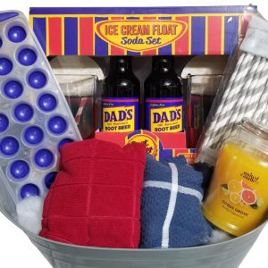 An Automotive Basket contains an ice cream float soda set with Dad's Root Beer bottles, a blue ice cube tray, red and blue dish towels, a yellow citrus-scented candle, and paper straws with red and gray patterns. Perfect for any occasion, this basket adds a touch of charm to your gathering.