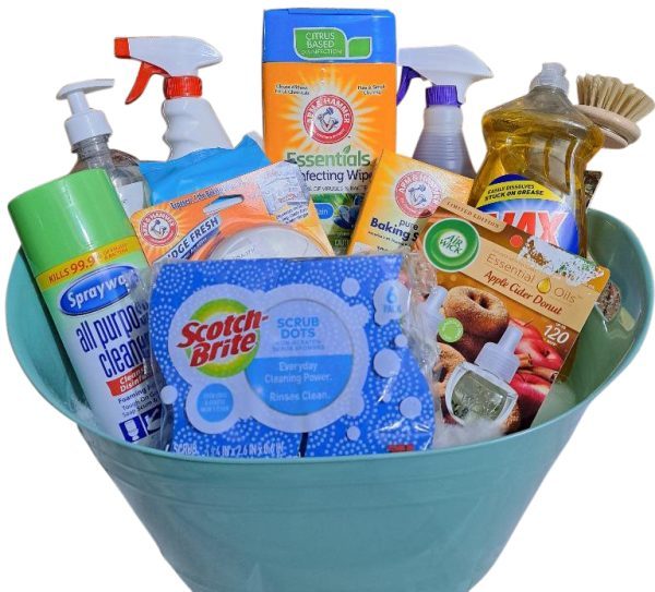 The Automotive Basket is a light green basket packed with an assortment of cleaning products, including disinfecting wipes, all-purpose cleaner, dish soap, spray cleaners, scrub brushes, citrus air freshener, and baking soda. The arrangement ensures that all items are visible and ready for use—mirroring a toolkit of cleanliness.