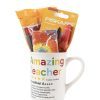 The Amazing Teacher Mug Gift Basket with Free Food Certificate features an "Amazing Teacher" design and a five-star rating. It comes filled with colorful school supplies, such as a pack of Fiskars scissors, pens, a tie-dye notebook, and sticky notes—an ideal addition to any thoughtful gift basket.