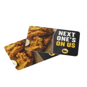 Two BW3's $25 Gift Cards stacked together, each featuring an image of chicken wings and dipping sauce. The top card displays the text "NEXT ONE'S ON US" in bold white letters on a black background, with the Buffalo Wild Wings (BW3) logo at the bottom.