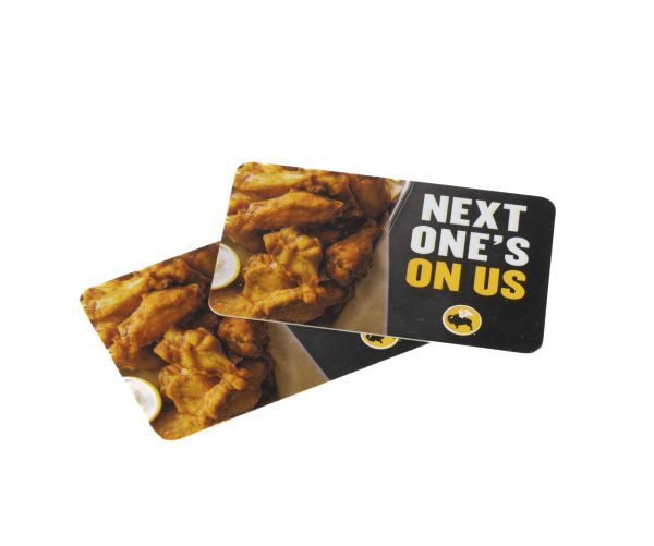 Two BW3's $25 Gift Cards stacked together, each featuring an image of chicken wings and dipping sauce. The top card displays the text "NEXT ONE'S ON US" in bold white letters on a black background, with the Buffalo Wild Wings (BW3) logo at the bottom.