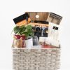 Luxury wine gift basket with wooden cutting board and stemless glasses for realtor closing gift.
