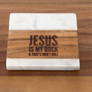 Introducing the "Jesus is my Rock & that's how I Roll - Square" coaster, crafted from a blend of white marble and wood. The wooden section elegantly features the engraving "JESUS IS MY ROCK & THAT'S HOW I ROLL." Resting on a wooden surface, this coaster seamlessly integrates rustic charm with spiritual inspiration.