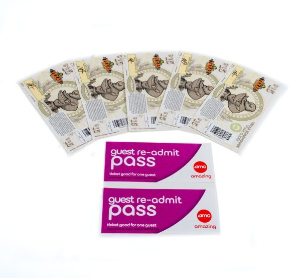 The image depicts seven animal-themed tickets arranged in a fanned-out pattern, showcasing cartoon rhinoceros artwork. Below these tickets are two AMC guest re-admit passes, ideal for inclusion in the Date Night Basket - Texas Road House Dinner & 2 Movie Passes. These passes feature a purple and white design labeled "ticket good for one guest.