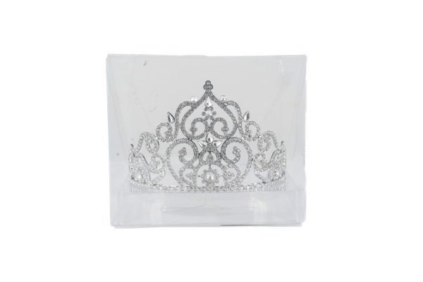 The Deluxe Tiara, showcased in a clear plastic box, features intricate scrollwork and sparkling rhinestones. Its central peak and symmetrical design make it a regal accessory perfect for occasions such as weddings, proms, or pageants.