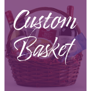 A wicker basket packed with various items, such as two bottles of wine, a package marked "Red Velvet," another labeled "Toscano," and a bag of snacks. The words "Custom Gift Basket" are prominently displayed on the image in large white script.