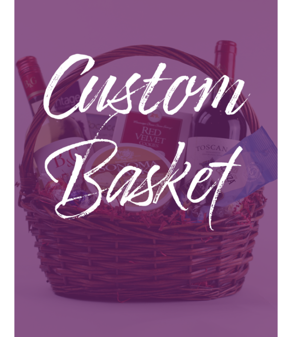 A wicker basket packed with various items, such as two bottles of wine, a package marked "Red Velvet," another labeled "Toscano," and a bag of snacks. The words "Custom Gift Basket" are prominently displayed on the image in large white script.