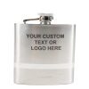 Introducing the Silver Flask - Your Custom Text/Logo Here. This sleek, metallic flask features a closed screw-on cap and is adorned with the words "Your Custom Text or Logo Here" printed in black on the front. It also showcases a small "rabbit" logo at the bottom and includes an elegant white stripe for added style.