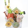 Medium Gardening Gift Basket for Spring featuring birdhouse and garden tools.