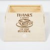 A small, wooden gift box called "Gift Box - Thanks a Whole Latte for your Referral" with an open lid. The lid rests against the box and features an engraving of a coffee cup with latte art. Above the cup, the text reads "THANKS A WHOLE LATTE," and below it says "FOR YOUR REFERRAL." This charming keepsake makes for a thoughtful referral thank you.