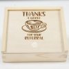 Introducing the "Gift Box - Thanks a Whole Latte for your Referral," featuring a wooden design with a sliding lid. Engraved on the lid is an illustration of a coffee cup with latte art, accompanied by the phrase "THANKS A WHOLE LATTE FOR YOUR REFERRAL.