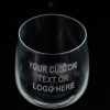 A clear, empty glass from the Pair of Rocks/Juice Glasses collection with the text "YOUR CUSTOM TEXT OR LOGO HERE" etched in white on its surface. The glass, ideal for juice, is set against a dark background.