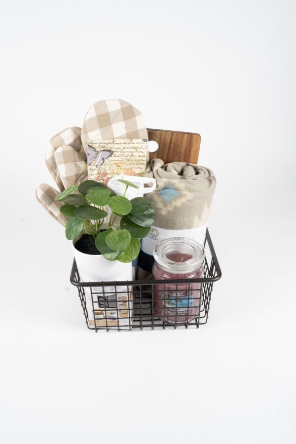 The BW3's Kitchen & Home Basket, which includes $50 in BW3's gift cards, contains various household items such as a small potted plant with green leaves, a jar candle, a folded blanket, wooden kitchen utensils, a checked oven mitt, and a small decorative sign. The background is white.