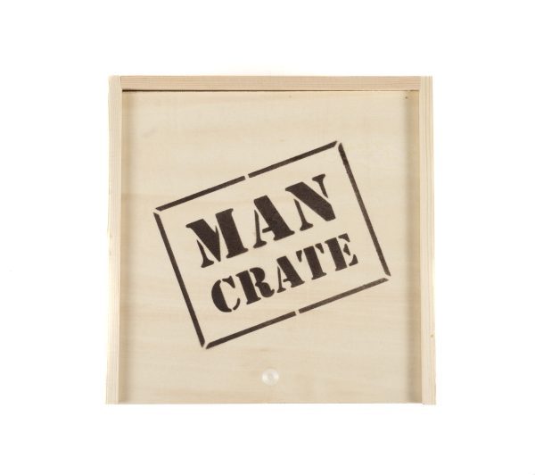 The Man Crate Gift Box is a wooden crate with "MAN CRATE" stenciled in bold black letters on the front, featuring a simple, unfinished look.