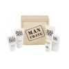 A wooden crate labeled "Man Crate Gift Box" is surrounded by various skincare products from the brand Bulldog. The gift box includes face washes, moisturizers, and shaving items, all in white packaging with the brand and product names clearly visible.