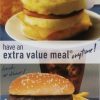 McDonald's promotional poster featuring breakfast and lunch options. The top section showcases a You Are My BFF Mug Gift Basket with Free Food Certificate and a breakfast sandwich with the caption "breakfast...". The bottom section displays a burger, fries, and a drink with the text "have an extra value meal® anytime! lunch or dinner!