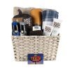 Large Men's Spa Basket with $40 Texas Roadhouse Dinner for Two Certificate: Woven basket filled with grooming products, including two Bulldog skincare tubes, Every Man Jack shaving cream, two AXE body sprays, a blue and gray plaid blanket, a tan towel, and an orange bottle.