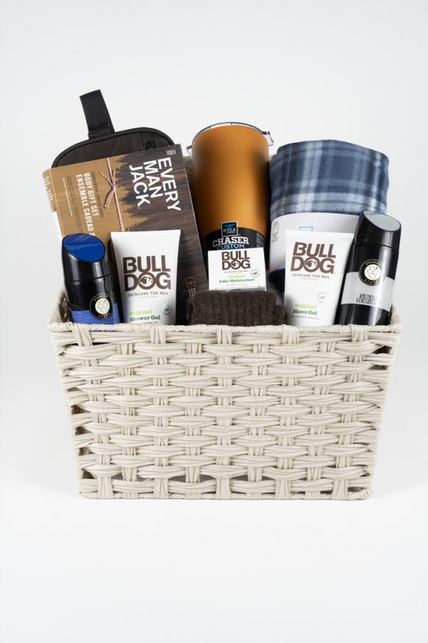 The Adult Gambling Night Basket includes a beige woven basket filled with grooming products such as the Bulldog Original Bamboo Razor, Bulldog Original Shave Gel, Bulldog Original Moisturizer, and Bulldog Original Face Wash. It's perfect for adults prepping for a big night out or winding down after an exciting gambling night.