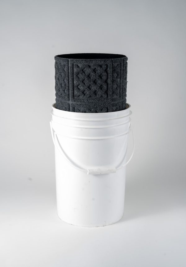 The Adult Gambling Night Basket, consisting of a white plastic bucket with a handle and a black textured rubber mat featuring raised square patterns rolled up inside, is set against a plain light gray background.