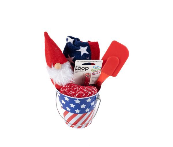 The small Patriotic Pail with red, white, and blue stars and stripes comes filled with a gnome figurine in a red hat, patriotic socks, a red exfoliating glove, a red spatula, Loop Earplugs, and even includes a free food certificate.