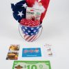 Introducing the Patriotic Pail with Free Food Certificate: a star-spangled collection featuring a red, white, and blue towel, kitchen utensils, an oven mitt, gift cards, restaurant coupons from Wendy's, Texas Roadhouse, McDonald's and more. Perfect for showcasing your patriotic spirit while enjoying great dining deals.