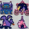 The Princess Craft Kit features four vibrant wooden cutouts: a castle with lit chandeliers, a carriage with a dancing figure, a dragon breathing fire near a tower, and a princess's dress with a castle. The intricate designs burst with blue, purple, pink, and yellow hues.