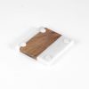 The "Pair Square Coasters - Home Sweet Home" features a minimalist square design with a striking contrast: half white marble and half brown wood. The white marble section is detailed with four small round pads at each corner for support and stability, making it a chic addition to any home.