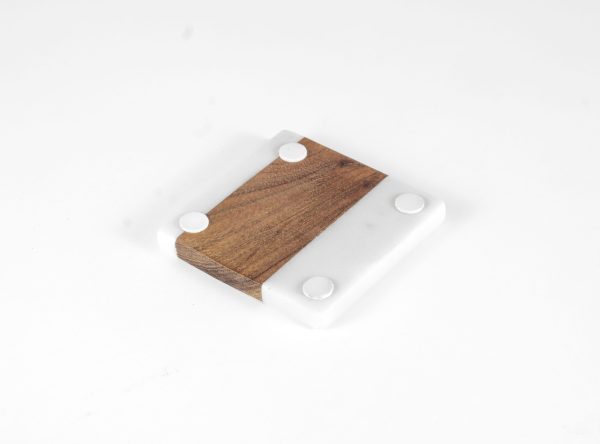 The "Pair Square Coasters - Home Sweet Home" features a minimalist square design with a striking contrast: half white marble and half brown wood. The white marble section is detailed with four small round pads at each corner for support and stability, making it a chic addition to any home.