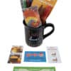 The Teach Love Mug Gift Basket with Free Food Certificate includes a black "Teach Love Inspire" mug accompanied by multicolored pens, orange scissors, and a tie-dye item. Surrounding the mug are free food certificates for McDonald's, Wendy's, and Texas Roadhouse.