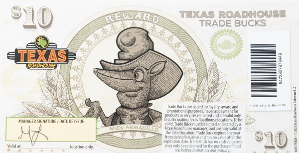 A $10 Texas Roadhouse Trade Bucks voucher featuring an illustration of "Andy Armadillo" wearing a cowboy hat. The voucher, complete with Texas Roadhouse branding, includes space for a manager's signature and date of issue—making it a perfect addition to the Adult Gambling Night Basket.