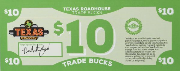 An image of a $10 Texas Roadhouse Trade Buck included in the "You are my BFF Mug Gift Basket with Free Food Certificate." The green food certificate features the Texas Roadhouse logo, a manager's signature, and usage terms on the right side. The words "$10 Trade Bucks" are prominently displayed in the center, with decorative elements around the edges.