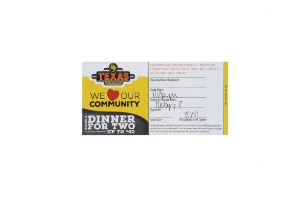 A Large Men's Spa Basket includes a prominently featured $40 Texas Roadhouse Dinner for Two Certificate. The certificate states, "We love our community," and offers a free dinner for two, up to a $40 value. It includes fields for the recipient's name, organization, and signature, along with the issuer's name and other details.