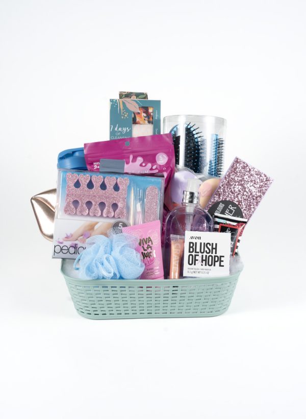 The Adult Gambling Night Basket is a pastel green basket filled with an assortment of beauty and self-care items, perfect for a relaxing night. It includes a pedicure set, hairbrushes, makeup brushes, nail file, nail polish remover, pink glittery makeup pouches, body scrubber, "Blush of Hope" lotion, and bath soaks. This basket is ideal for unwinding after an exciting adult gambling night.