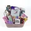 The Adult Gambling Night Basket is a thoughtful gift that includes various personal care essentials such as perfumes, lotion, an exfoliating sponge, a water bottle, a loofah, a candle, nail care products, and a notebook. Ideal for adults looking to unwind after an evening of entertainment. The items come in vibrant packaging within an elegant beige lattice pattern basket.