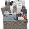 Luxurious Spa Gift Basket for Her featuring plush robe, slippers and bath salts in a wicker basket.