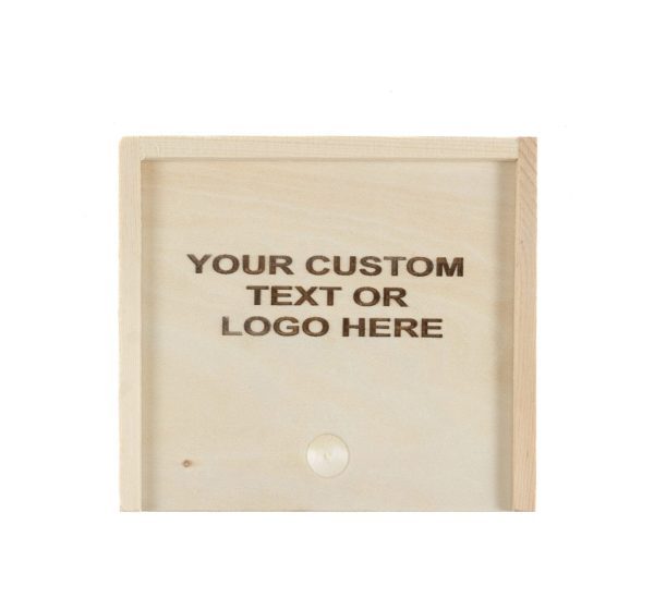 A light-colored wooden gift box, gift card size, features an engraved message in the center that reads, "YOUR CUSTOM TEXT OR LOGO HERE." The darker engraving contrasts sharply with the wood.